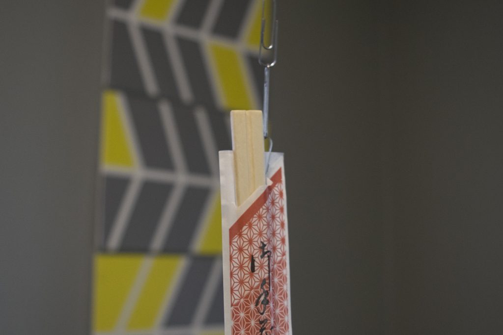 Chopsticks hanging by paper clips