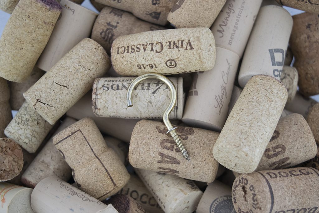 A brass hook on wine corks